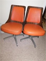 Mid century wooden and chrome swivel chairs with