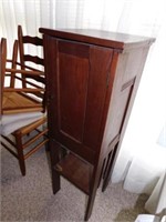 Antique mission style cabinet with bottom shelf,