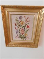 Needlepoint picture of flowers in gold frame, 12"