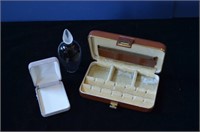 Brown case, jewelry box and perfume bottle