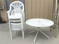 Patio table and 7 plastic chairs