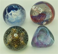 Lot 1248a - (4) Caithness art glass paperweights: