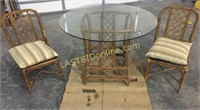 Two woven style chairs and table