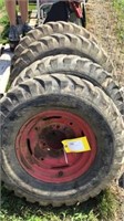 (4) Wheels & Tires off Case 1816 Skidsteer