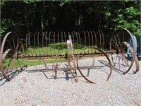 Horse drawn dump hay rake and four iron wheels
