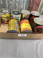 7 assorted oil cans, 1-quart size, some full