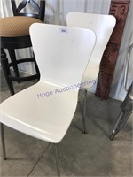 White plastic chairs, pair