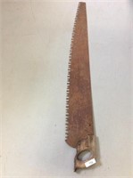 Vintage hand timber saw measuring 59 inches long