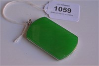 Chinese cartouche shaped green jade pendant