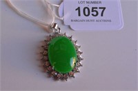 Chinese oval shaped green jade pendant,