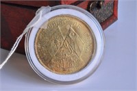 Chinese cased gilt coin,