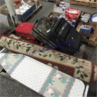 Suitcase, area rug, ironing board