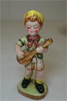 Boy musician figurine