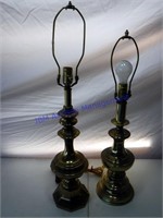Two brass lamps with no shades