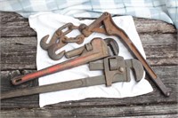 2 pipe wrenches & a chain binder