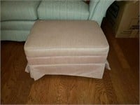 Roll around upholstered foot stool