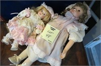 PAIR OF PORCELAIN DOLLS