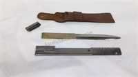 Haircutting comb and razor in leather pouch