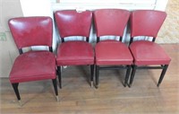 Set of four red vinyl side chairs