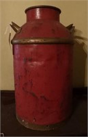 Primitive double handled milk can in red wash