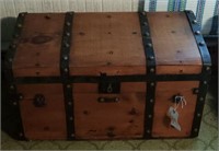 Primitive breadloaf style shipping trunk with