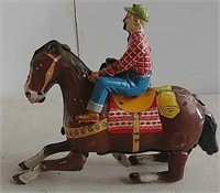 Tin Japan windup jockey toy