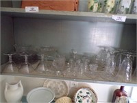WHOLE SHELF OF CLEAR GLASS DISHES