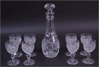 An 11" cut glass decanter with stopper and