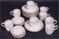 Eight Haviland after dinner cups and saucers, and