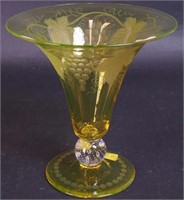 An etched vaseline glass vase, 8" high, with a