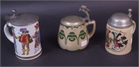 Three tankards including one porcelain