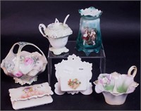 Six pieces of porcelain including hatpin holder,
