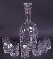 A crystal decanter with stopper signed