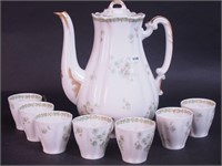 A porcelain coffeepot marked Limoges