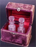 A pair of 3 1/2" cut glass perfume bottles