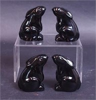 Four black crystal rabbits marked Baccarat