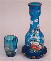 A blue glass carafe, 11" high, decorated with