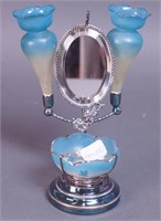 A miniature silverplate stand with blue glass
