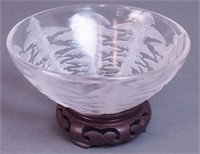 A glass 5" bowl with dandelion leaf motif marked