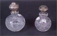 Two non-matching crystal dresser bottles with