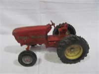 Red iron toy tractor