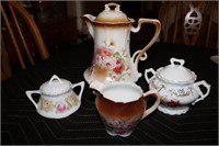 Teapot, creamer and two sugars-floral design