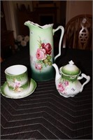 Floral green glassware including pitcher, teapot