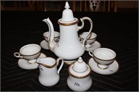 White Teapot, cups and saucers, cream and sugar
