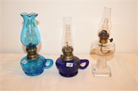 Three miniature oil lamps