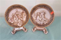 (2) Raised Relief Plates With Stands