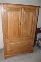 Oak entertainment center with doors and drawers