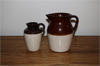 Two brown stoneware pitchers one marked USA