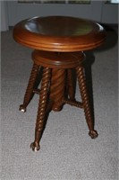 Piano stool with spindle legs and claw feet