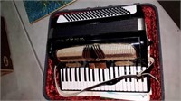 HORNER ACCORDION IN CASE, WITH MUSIC BOOKS,